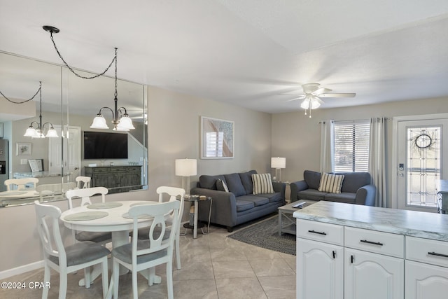 living room with ceiling fan and light tile patterned floors