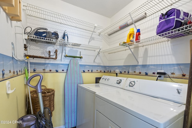 laundry area with washing machine and dryer