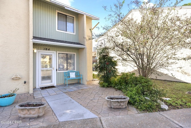 doorway to property featuring a patio