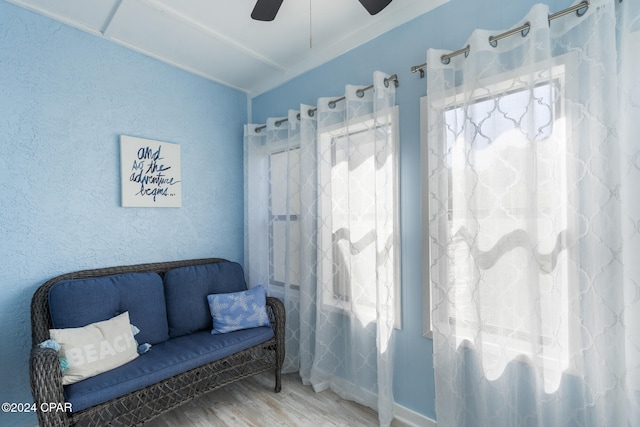 sitting room featuring ceiling fan, lofted ceiling, and hardwood / wood-style flooring