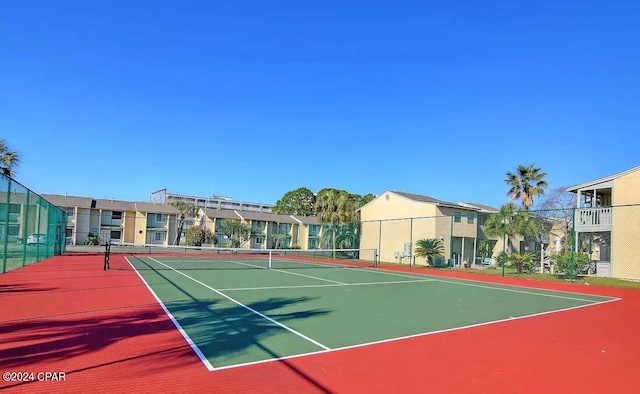 view of sport court with basketball hoop