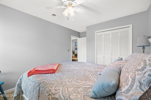 bedroom with a closet and ceiling fan