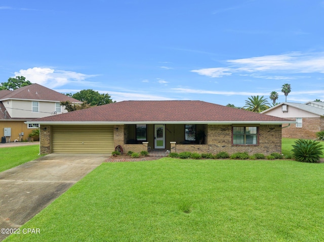 view of front of house featuring a front lawn and a garage