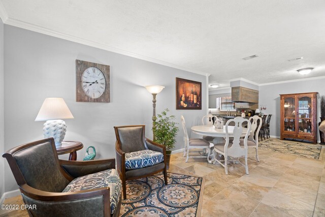 living room with a textured ceiling and crown molding