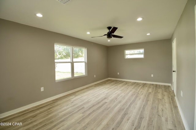 spare room featuring ceiling fan and light wood-type flooring