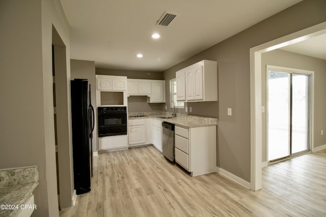 kitchen with sink, light hardwood / wood-style flooring, black appliances, and white cabinets