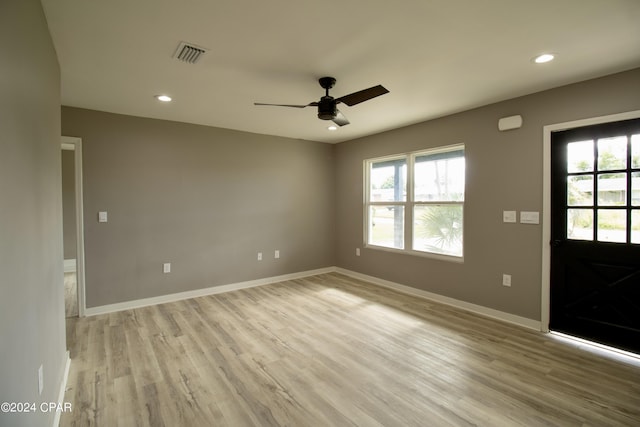 interior space featuring ceiling fan, light hardwood / wood-style floors, and a healthy amount of sunlight