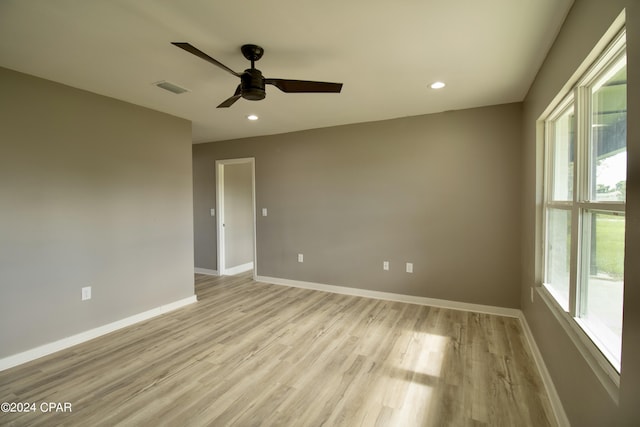 unfurnished room with ceiling fan and light hardwood / wood-style floors