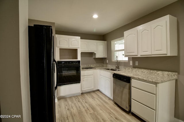 kitchen featuring white cabinetry, sink, light wood-type flooring, and black appliances