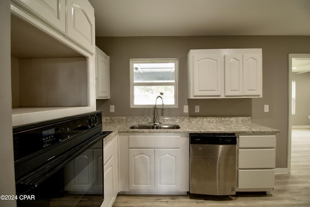 kitchen with sink, dishwasher, white cabinetry, light hardwood / wood-style floors, and oven