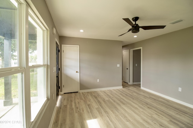 spare room featuring ceiling fan and light hardwood / wood-style floors