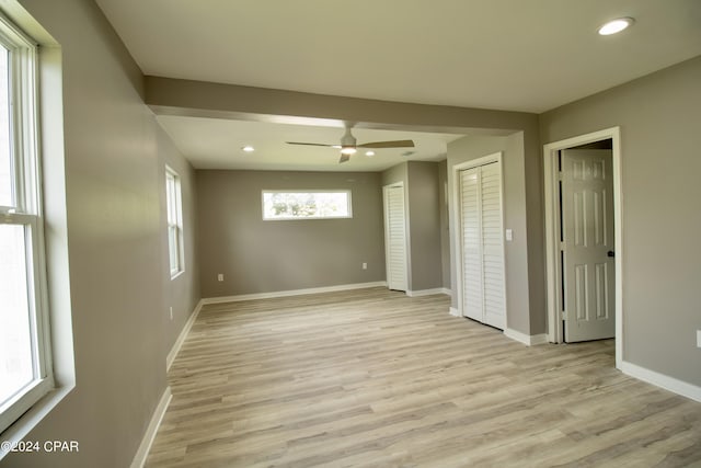 unfurnished room featuring ceiling fan and light wood-type flooring