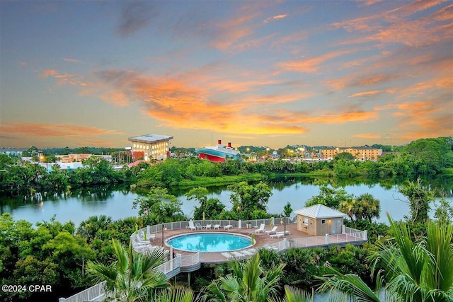 pool at dusk with a water view