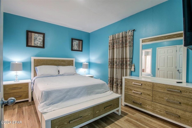 bedroom with light hardwood / wood-style floors