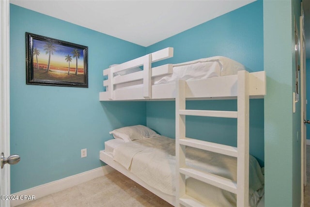 bedroom with light tile patterned flooring