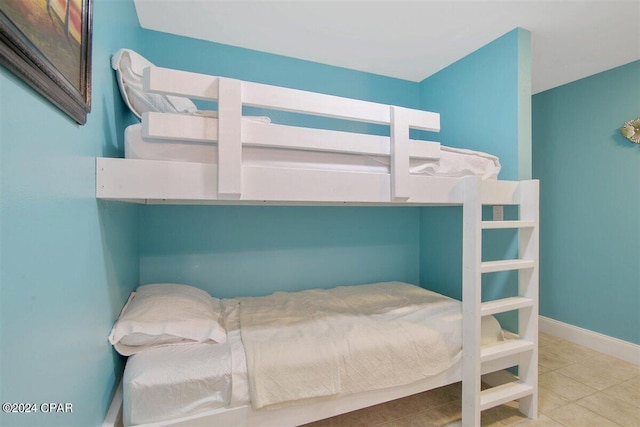 bedroom featuring light tile patterned floors