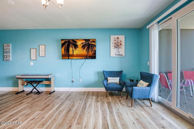 sitting room featuring light hardwood / wood-style flooring