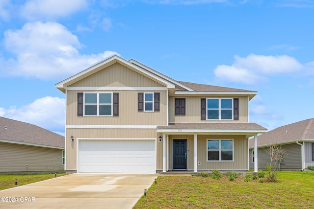 view of front of home featuring a garage and a front yard