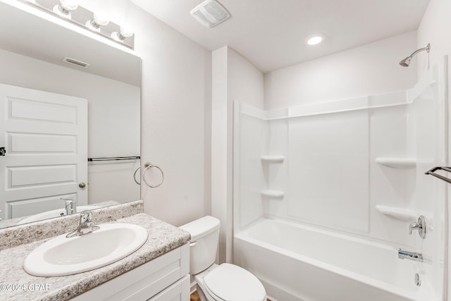 full bathroom with vanity,  shower combination, and toilet