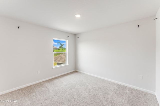 spare room featuring carpet flooring