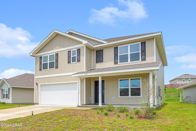 view of front of home with a garage and a front yard