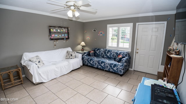 living room featuring light tile patterned floors, ceiling fan, and crown molding