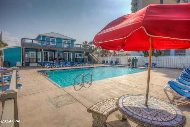 view of swimming pool featuring a patio area