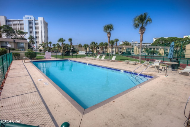 view of pool featuring a patio