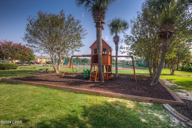 view of jungle gym featuring a lawn