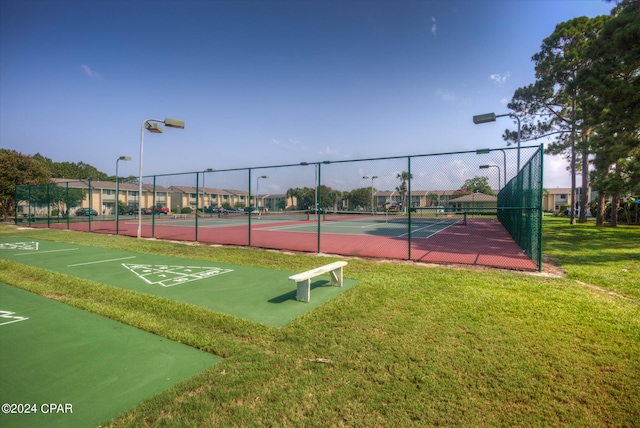 exterior space featuring a yard and tennis court