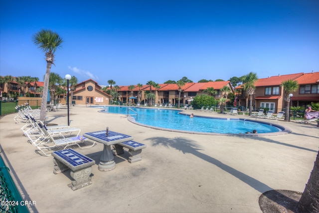 view of swimming pool featuring a patio area