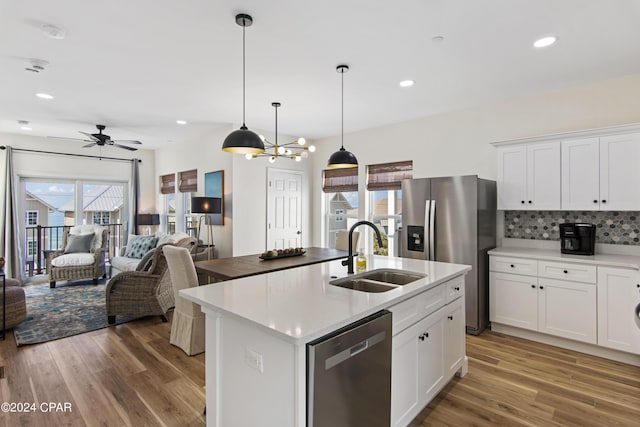 17674 Front Beach Rd Unit 10Units, Panama City Beach, FL 32413 - kitchen featuring light wood-type flooring, a sink, ceiling fan with notable chandelier, open floor plan, and stainless steel appliances
