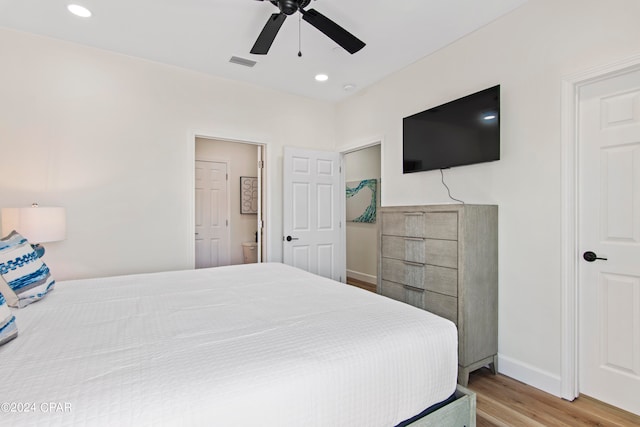 bedroom with light hardwood / wood-style flooring and ceiling fan