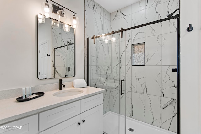 bathroom featuring vanity and an enclosed shower