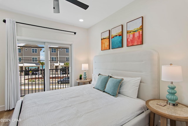 bedroom featuring hardwood / wood-style flooring, access to outside, and ceiling fan