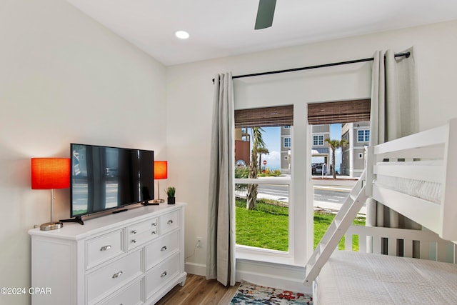 bedroom featuring light hardwood / wood-style floors, multiple windows, and ceiling fan