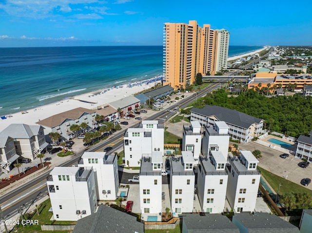 bird's eye view featuring a water view and a view of the beach