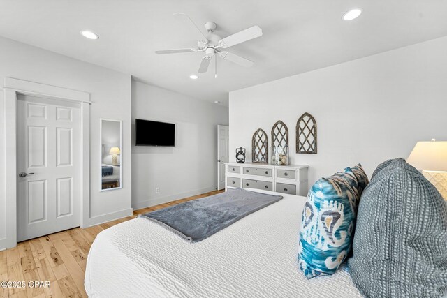 bedroom featuring ceiling fan and hardwood / wood-style floors