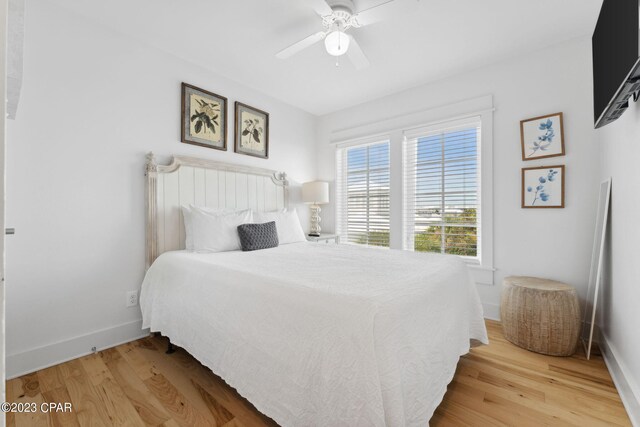 bedroom featuring hardwood / wood-style flooring and ceiling fan