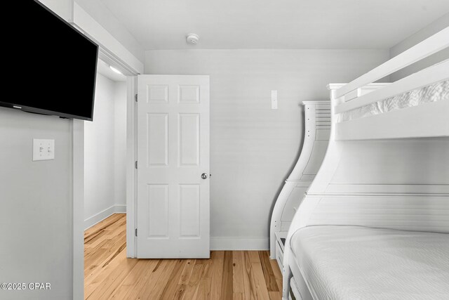 unfurnished bedroom featuring hardwood / wood-style flooring