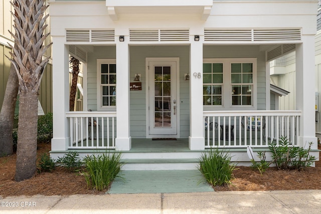 doorway to property with a porch