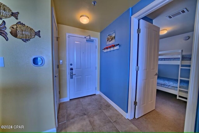 entryway featuring light tile patterned floors