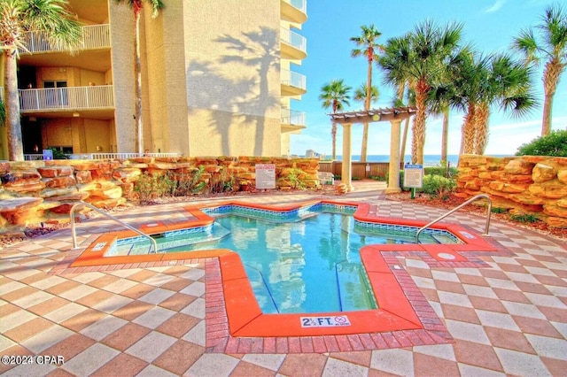 view of swimming pool with a pergola