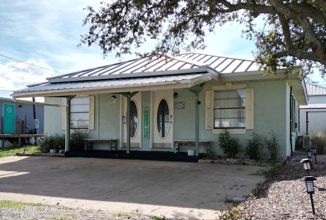 view of front of house featuring central air condition unit and covered porch