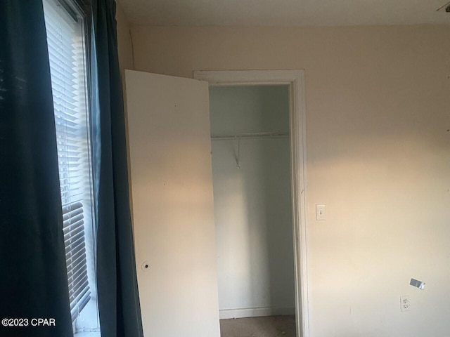 unfurnished bedroom featuring a closet