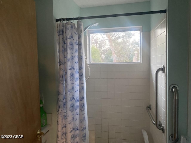 bathroom featuring curtained shower