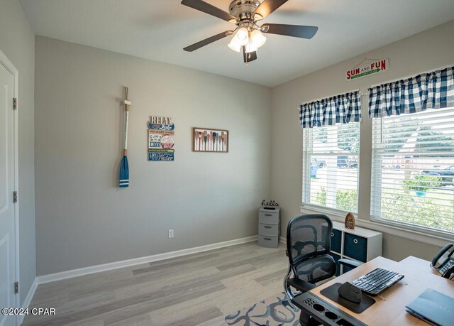 office area with ceiling fan and light hardwood / wood-style floors