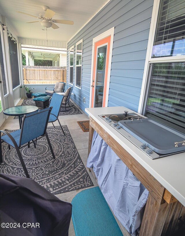 view of patio with ceiling fan