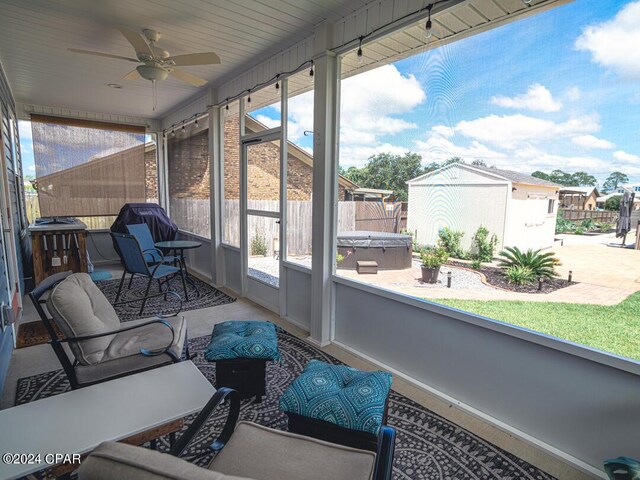 sunroom featuring ceiling fan