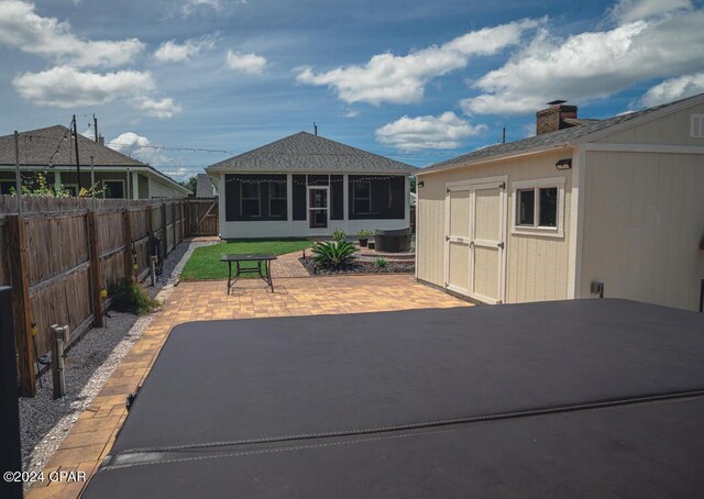 view of patio / terrace with a sunroom